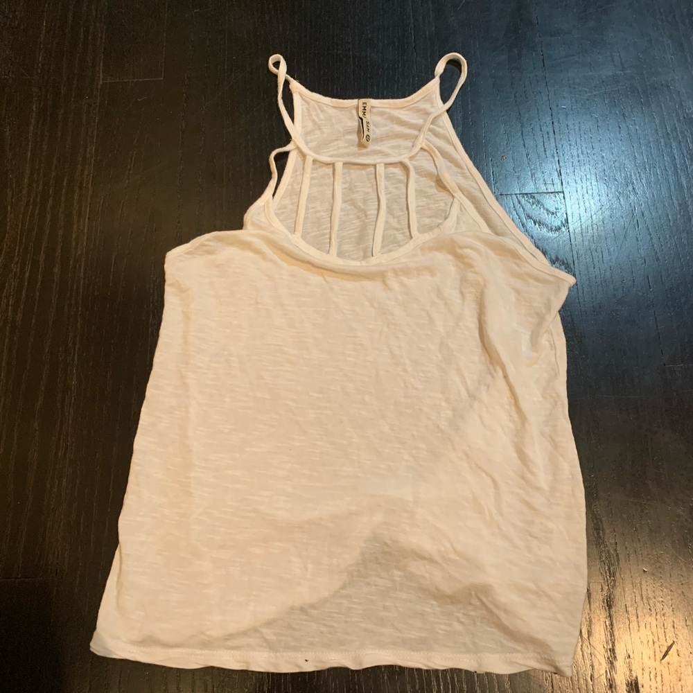 White tank top with rectangle cut outs on the neck